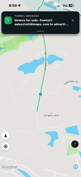 A WilDi tunnel ad delivered on the phone of someone traveling a road corridor